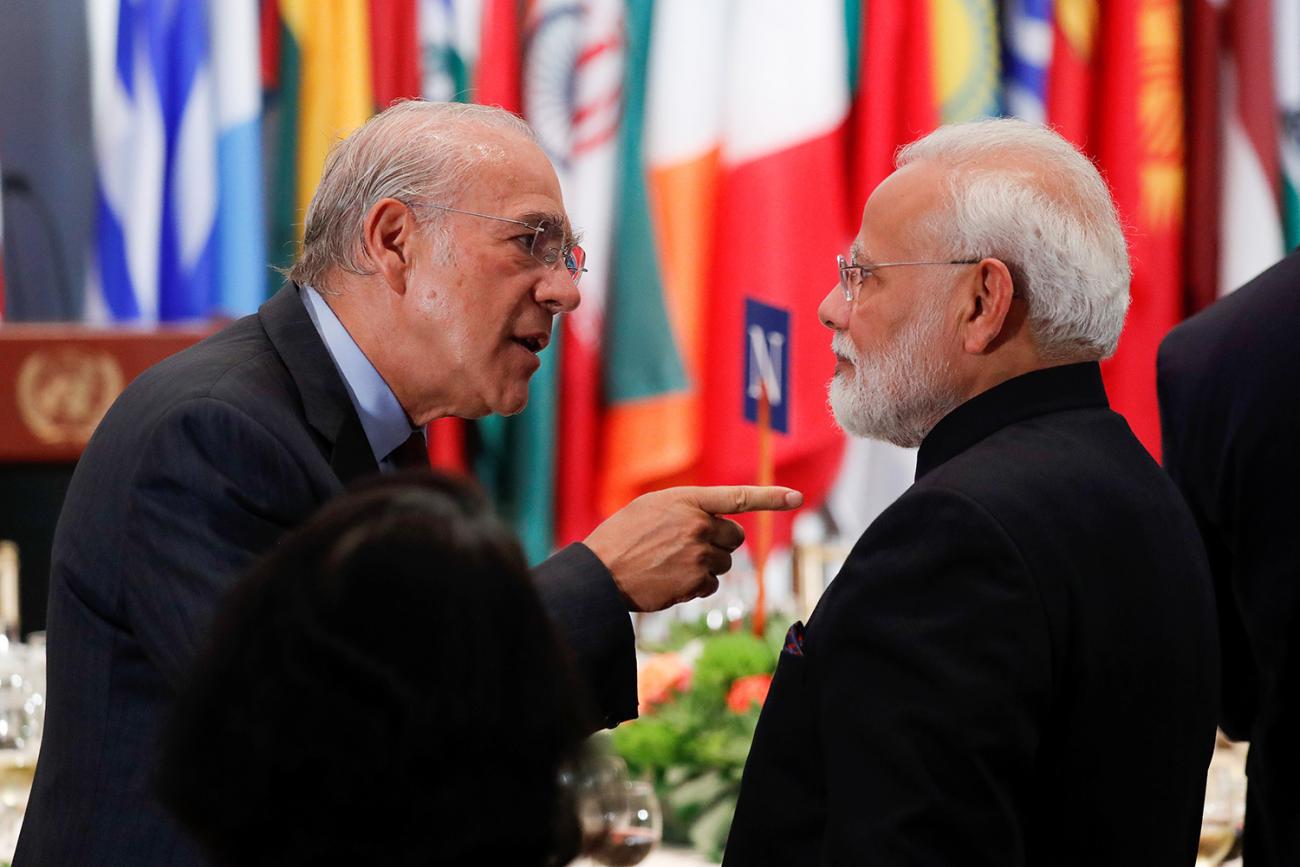 The photo shows the two leaders in what appears to be a heated exchange with Gurria pointing his finger at the India PM. 