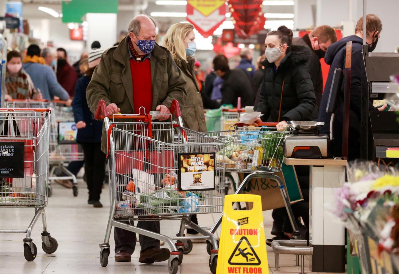 People shop at a Sainsbury's store, amid the coronavirus disease (COVID-19) outbreak, in London, Britain December 22, 2020. 