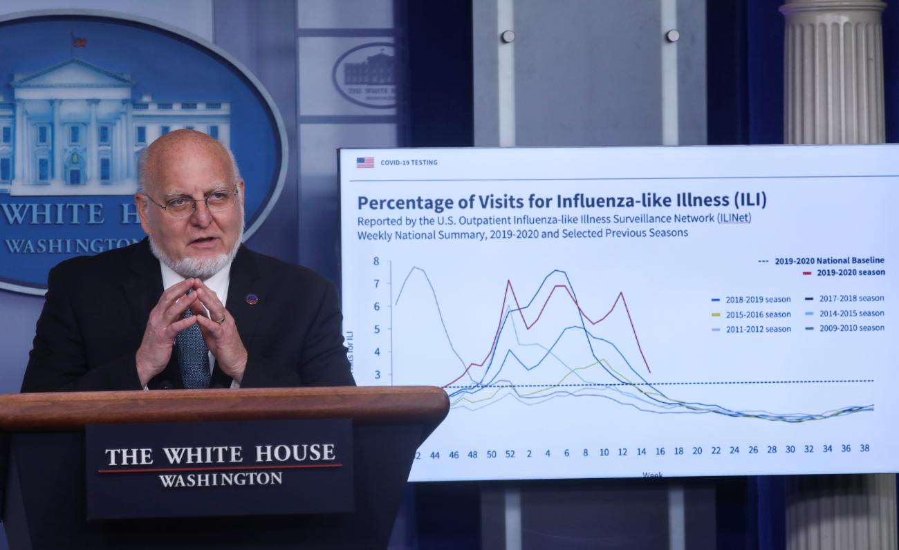 Centers for Disease Control (CDC) Director Robert Redfield explains illness surveillance programs in the United States in front of a chart showing statistics of patients seeking treatment for influenza-like illnesses during the daily coronavirus task force briefing at the White House in Washington, U.S., April 17, 2020.