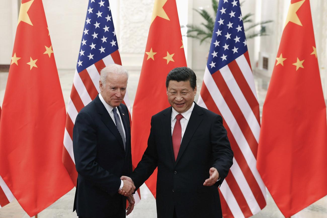 U.S. Vice President Joe Biden (L) shakes hands with Chinese President Xi Jinping ® inside the Great Hall of the People in Beijing, China on December 4, 2013.  REUTERS/Lintao Zhang/Pool 