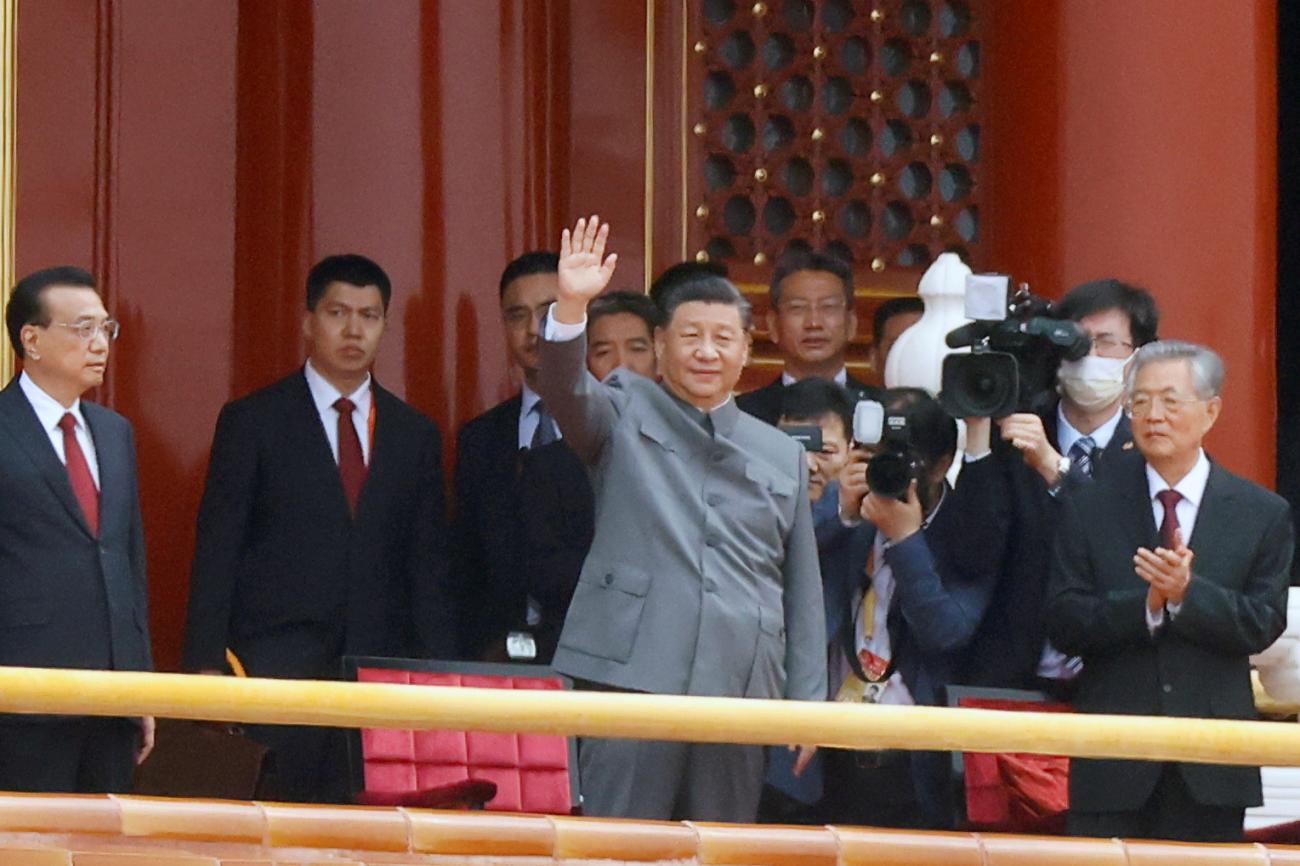 Chinese President Xi Jinping waves next to Premier Li Keqiang and former president Hu Jintao at the 100th founding anniversary of the Communist Party of China, in Tiananmen Square, Beijing, China on July 1, 2021.