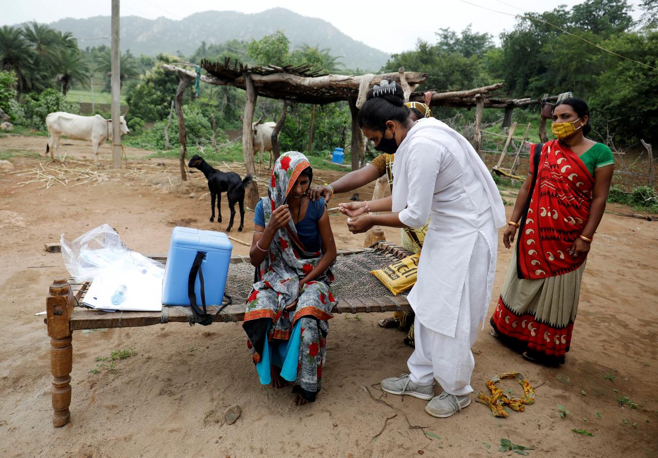 A health-care worker administers the COVISHIELD vaccine as part of a door-to-door vaccination drive in Banaskantha district in the western state of Gujarat, India, July 23, 2021.