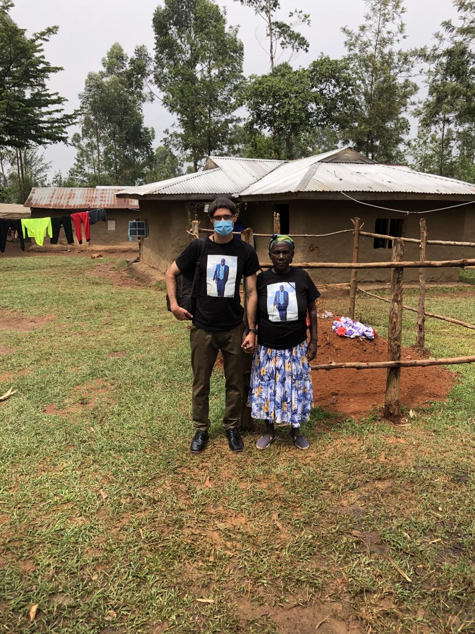 Luqman Mushila Hodgkinson with his mother, Rita Mutola Mushila at his father’s grave site, wearing matching shirts with Charles Mushila Shibeka’s photo. 
