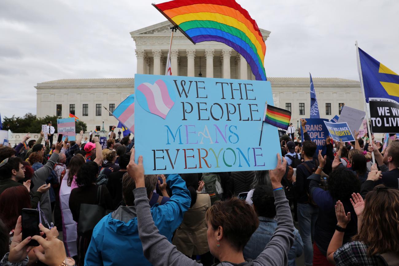 LGBTQ activists and supporters rally outside the U.S. Supreme Court as it hears arguments in a major LGBTQ rights case, in Washington, DC, on October 8, 2019.