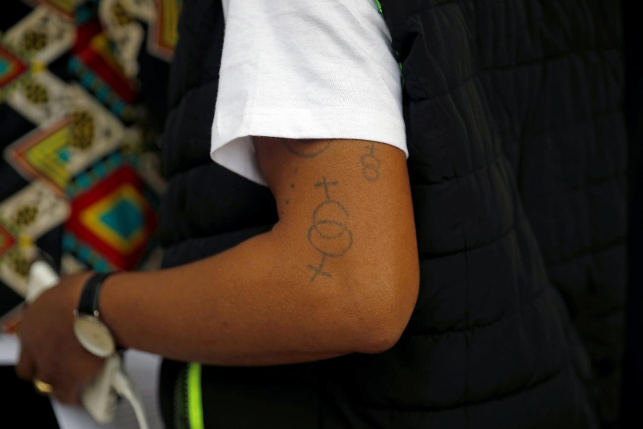 Tattoos on the arm of an LGBTQI+ activist after a ruling by Kenya's high court upheld a law banning gay sex, outside the Milimani Law Court in Nairobi, Kenya, on May 24, 2019. 