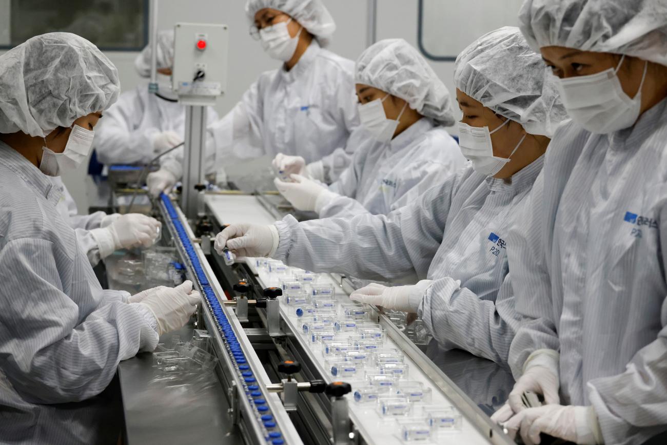 Workers at a Sputnik V factory package vaccines