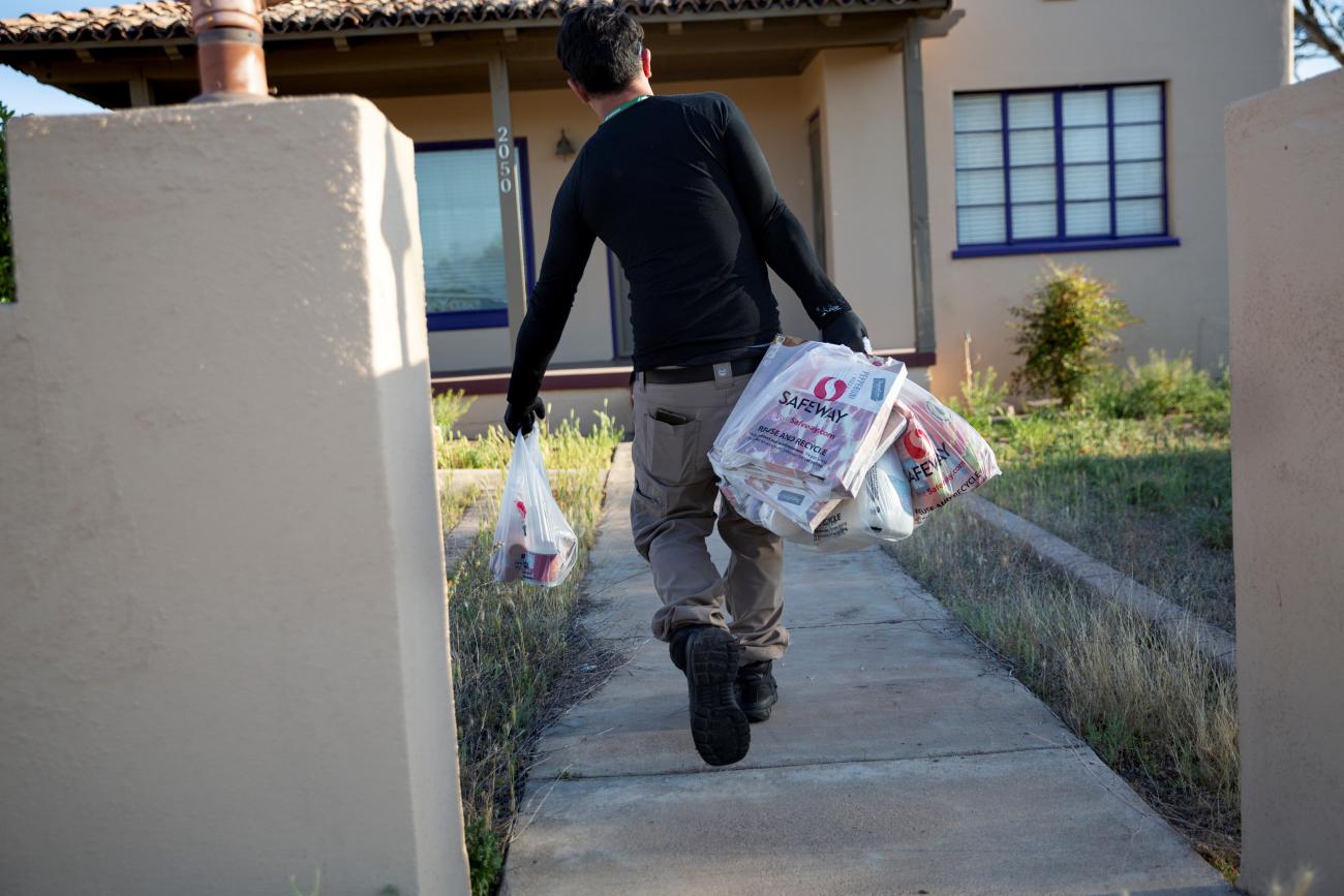 Instacart employee Eric Cohn, 34, delivers groceries to a residence.