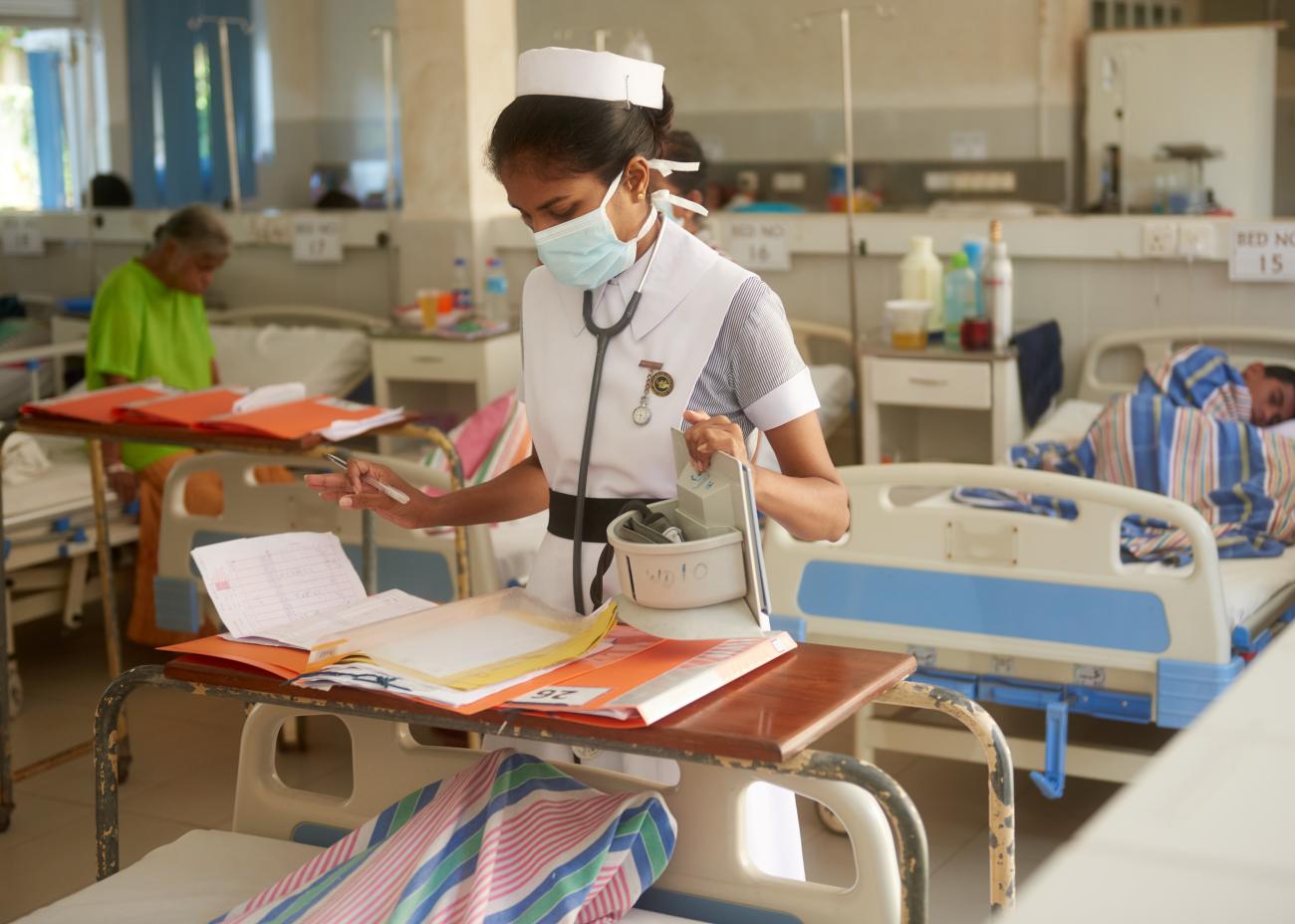 Nurses work around the clock to monitor patients during a dengue outbreak.