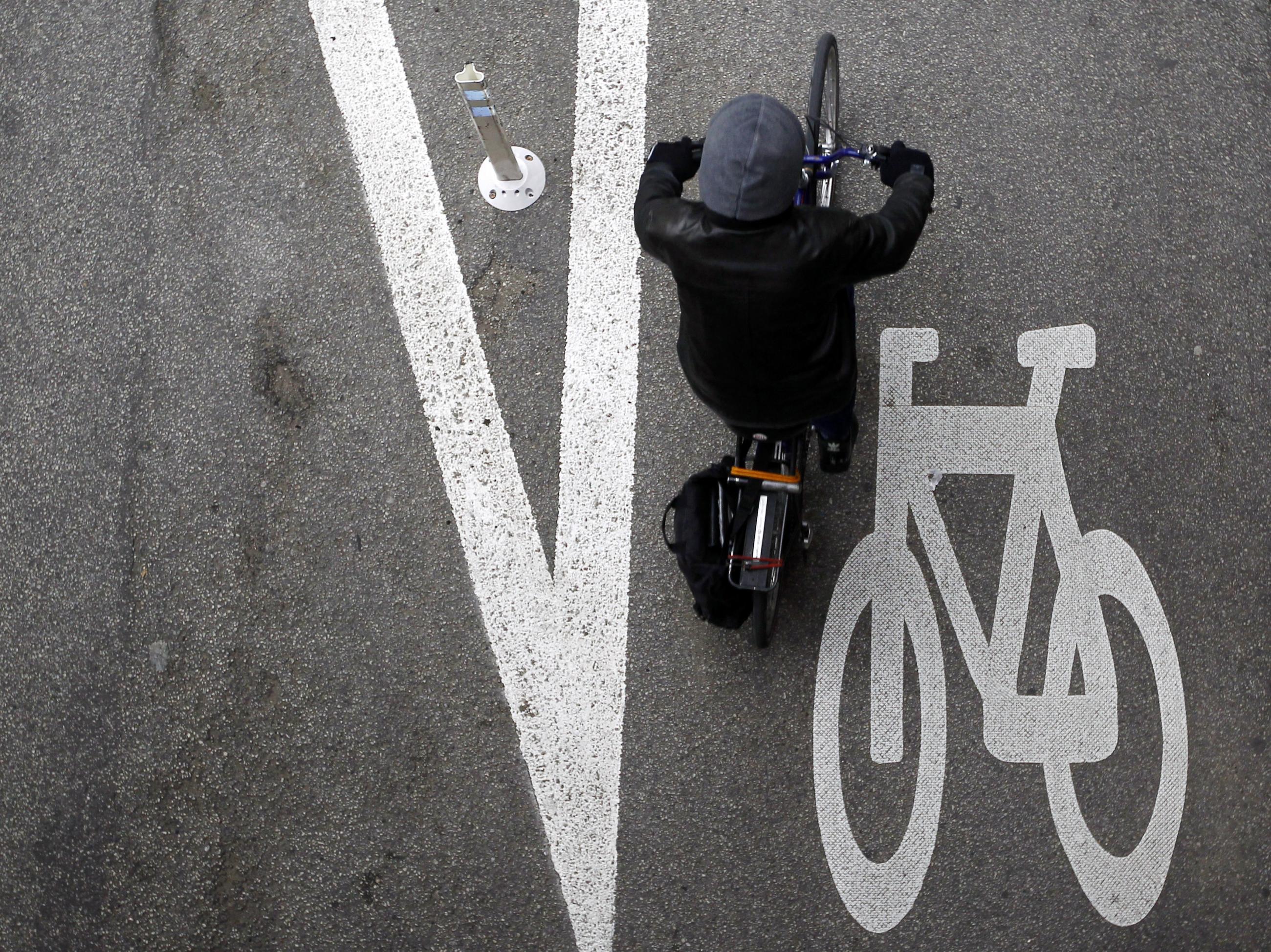 A cyclist rides along the Kinzie Protected Bike Lane in Chicago.