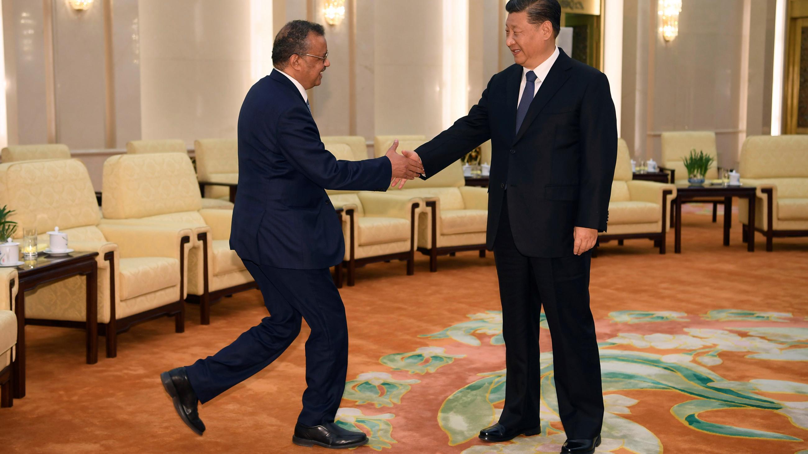 The photo shows the two leaders shaking hands and smiling. 