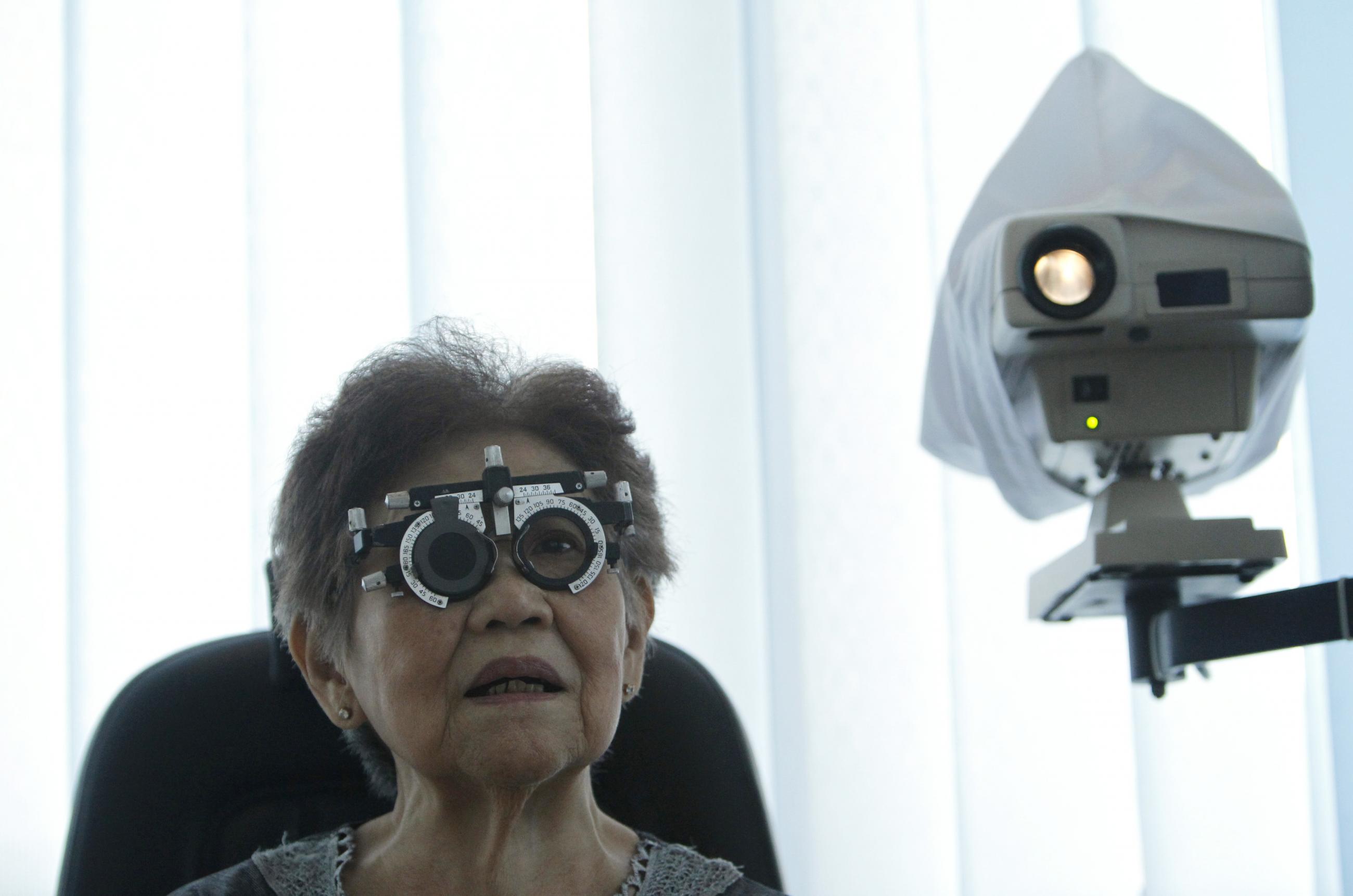 A woman gets her eyes checked at the Tambora community health center in Jakarta March 29, 2011.