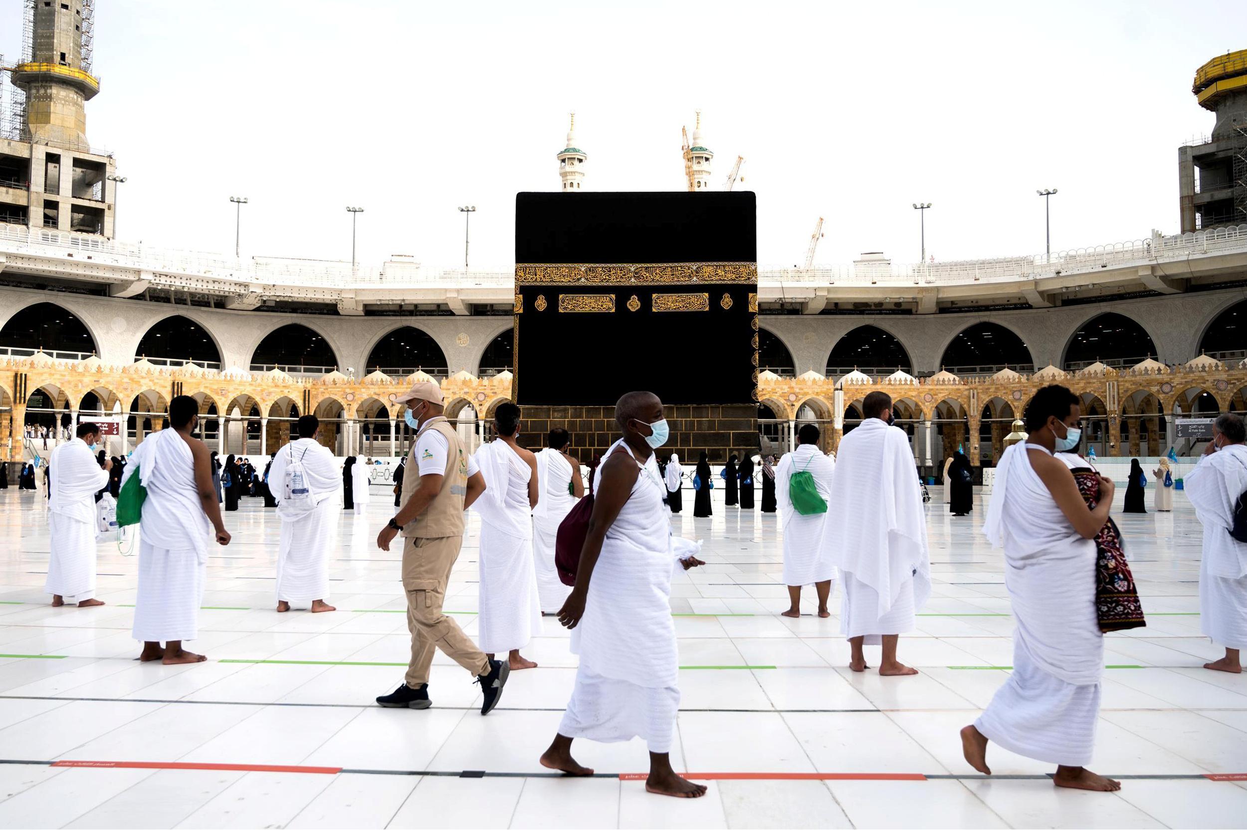 Muslim pilgrim wearing face masks and keeping social distance perform Tawaf around Kaaba during the annual Haj pilgrimage amid the coronavirus disease pandemic, in the holy city of Mecca, Saudi Arabia on July 31, 2020.