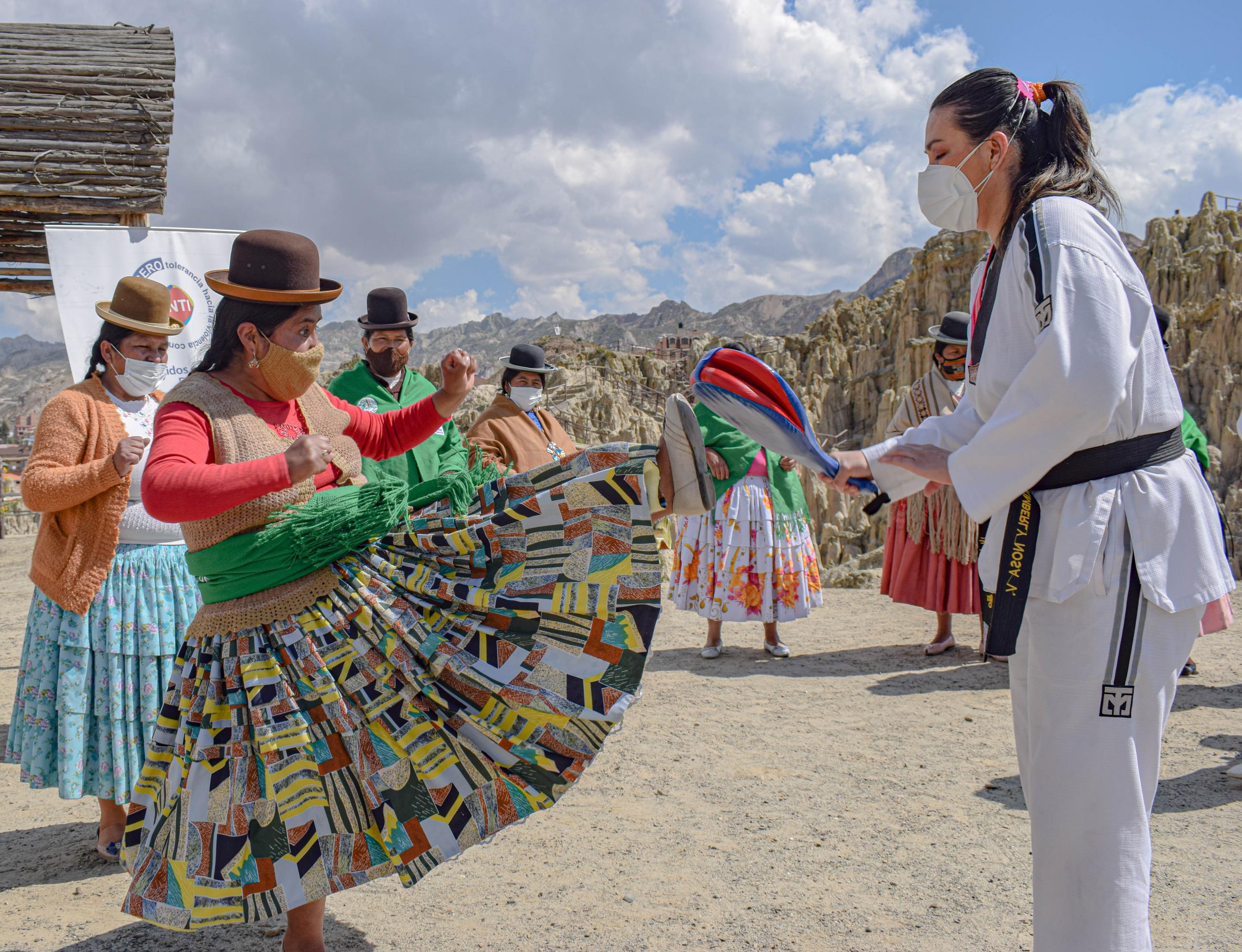 Bolivian Aymara women in colorful dresses learn self-defense on the outskirts of La Paz, Bolivia