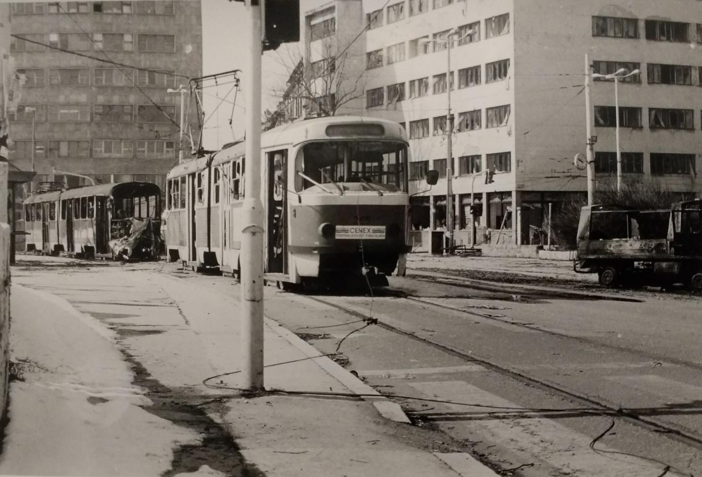 Shelled trams, Obala Kulina bana street. Sarajevo, 1992.