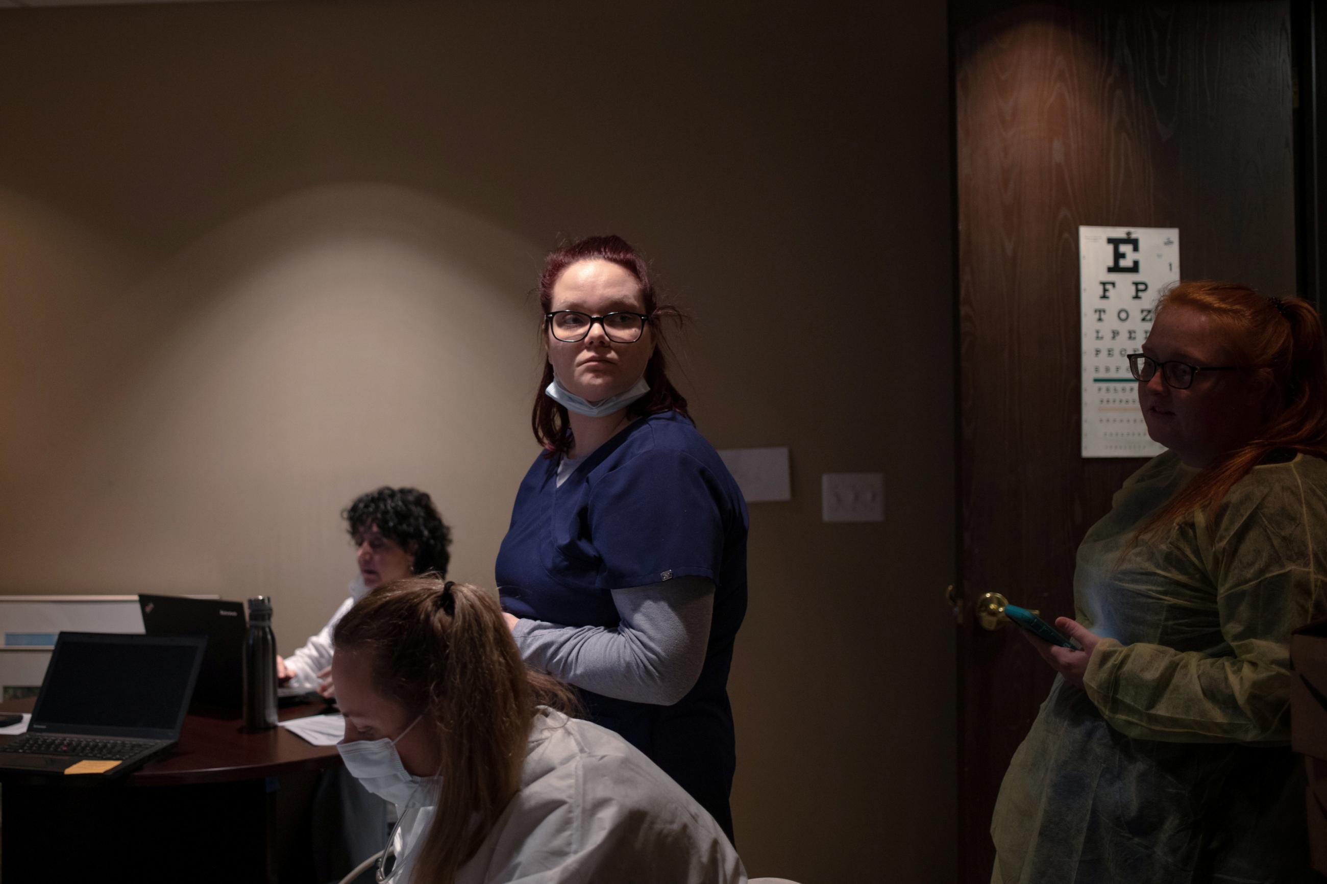 Student medical assistant Ashely Nichols waits with physicians as they gather for a tutorial session to learn how to conduct virtual appointments with their patients.