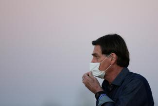 President Jair Bolsonaro is seen during a ceremony to lower the Brazilian National flag down for the night, at the Alvorada Palace, amid the coronavirus disease  outbreak, in Brasilia, Brazil on  July 15, 2020. 