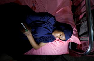 Ruqqayah Abubakar rests after being treated at an obstetric fistula repair center in Maiduguri, Nigeria, on August 1, 2018. 