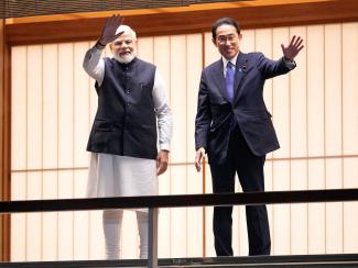 Indian Prime Minister Narendra Modi and Japanese Prime Minister Fumio Kishida wave after feeding carp ahead of their dinner at Akasaka State Guest House in Tokyo, Japan, on May 24, 2022. 