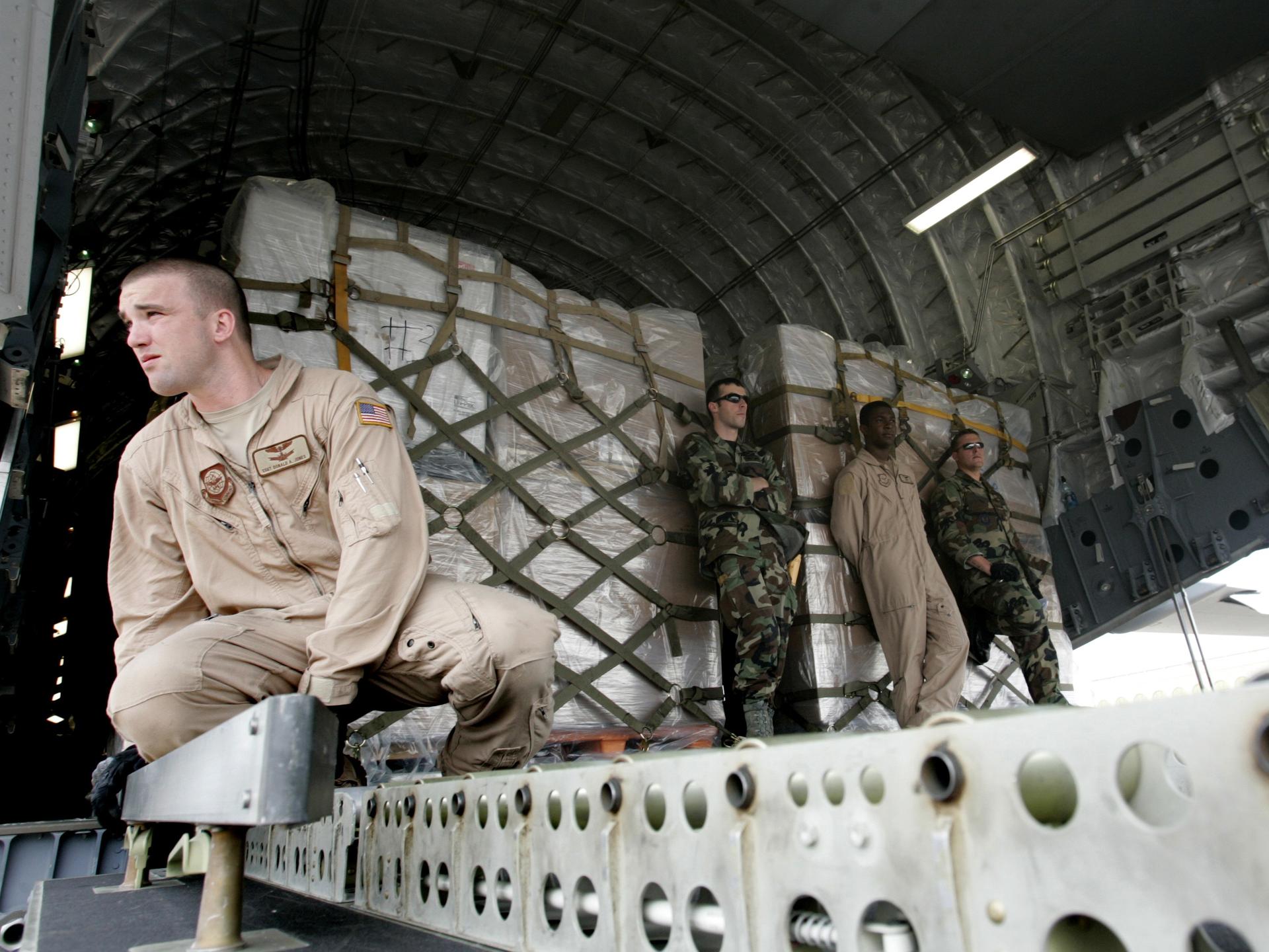 U.S. Air Force servicemen unload humanitarian aid from a U.S. military cargo plane at Tbilisi airport, in Tbilisi, Georgia, on August 14, 2008.