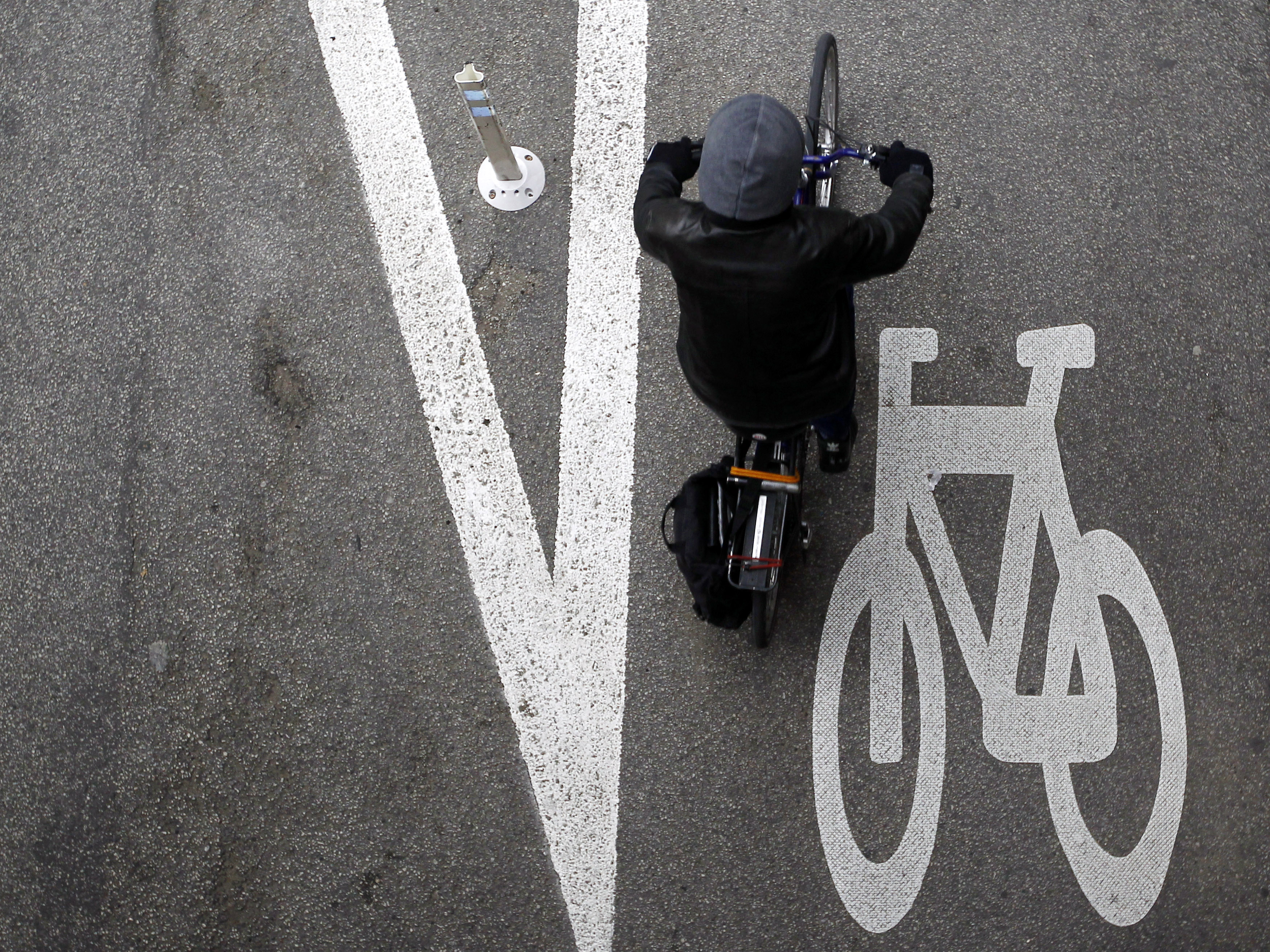 A cyclist rides along the Kinzie Protected Bike Lane in Chicago.
