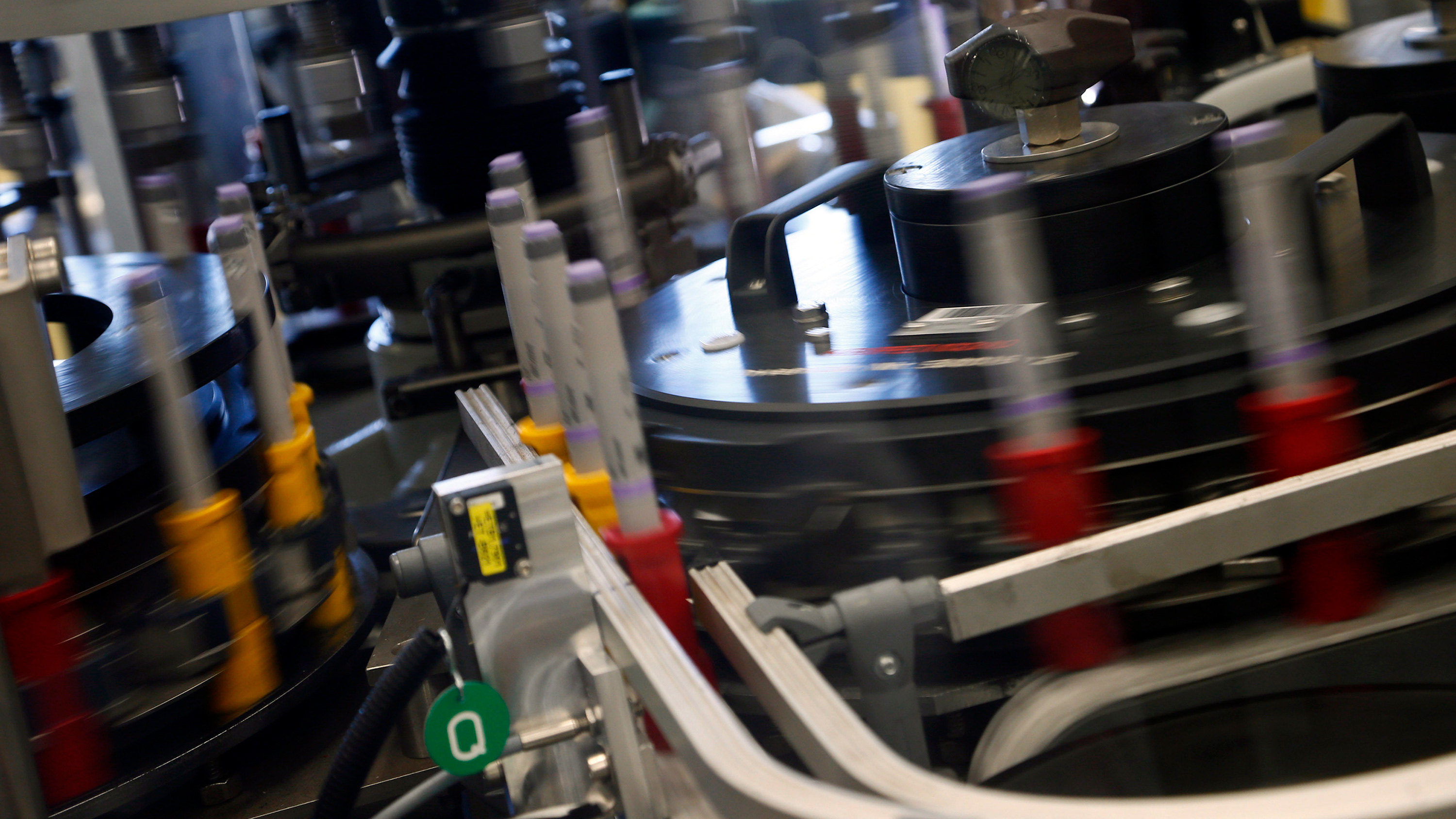 Photo shows what appears to be a high-tech, fast moving assembly line.