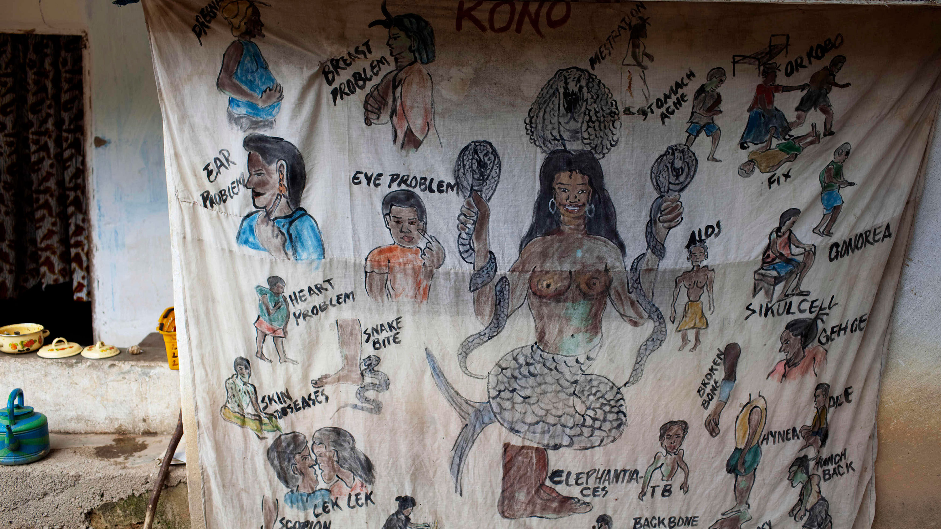 Picture shows a sheet hand drawn with figures and words describing a range of medical conditions that the traditional doctor presumably addresses.