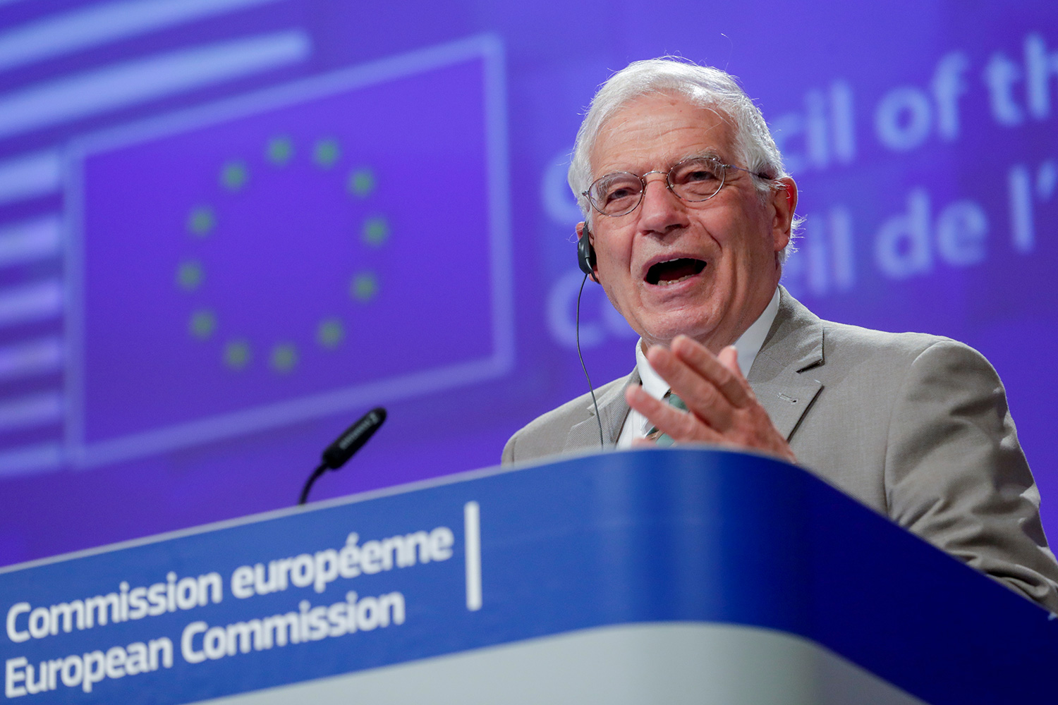 The photo shows the politician at a podium speaking.