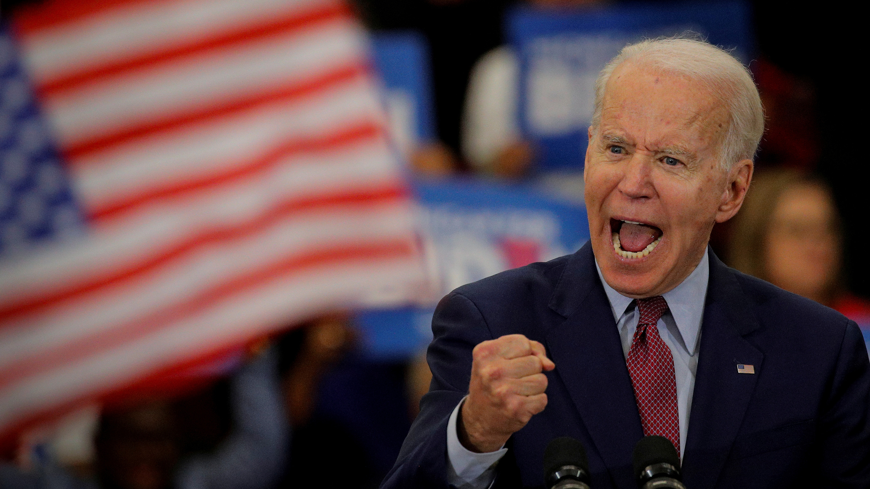 The photo shows the vice president making a fiery speech with the American flag in the background.