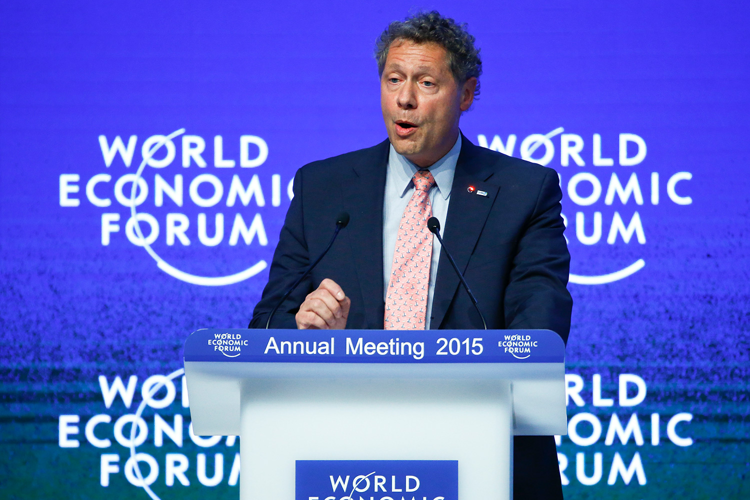 The photo shows Berkley at a podium speaking into a microphone.