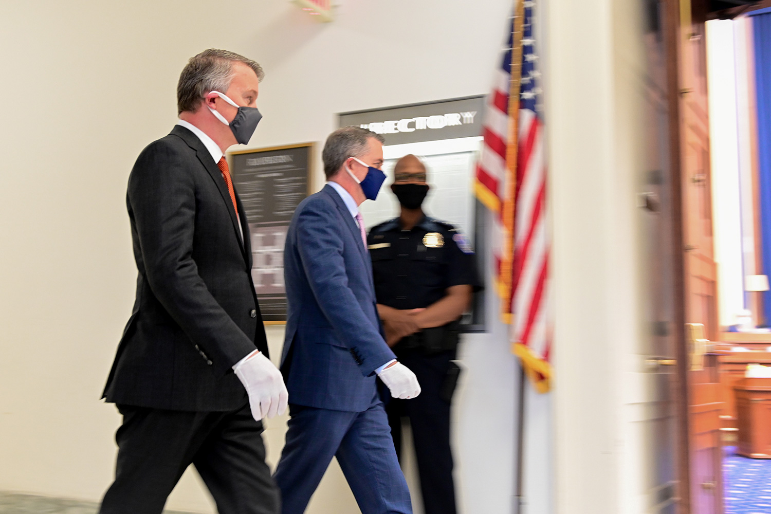 The photo shows the former official walking somewhere in the House building.