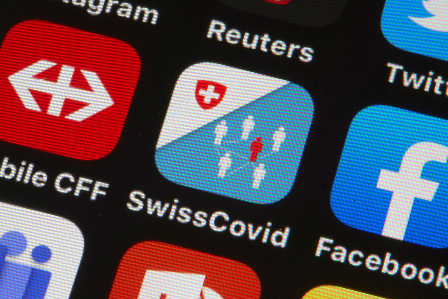 The photo shows a phone screen with the app in the middle.