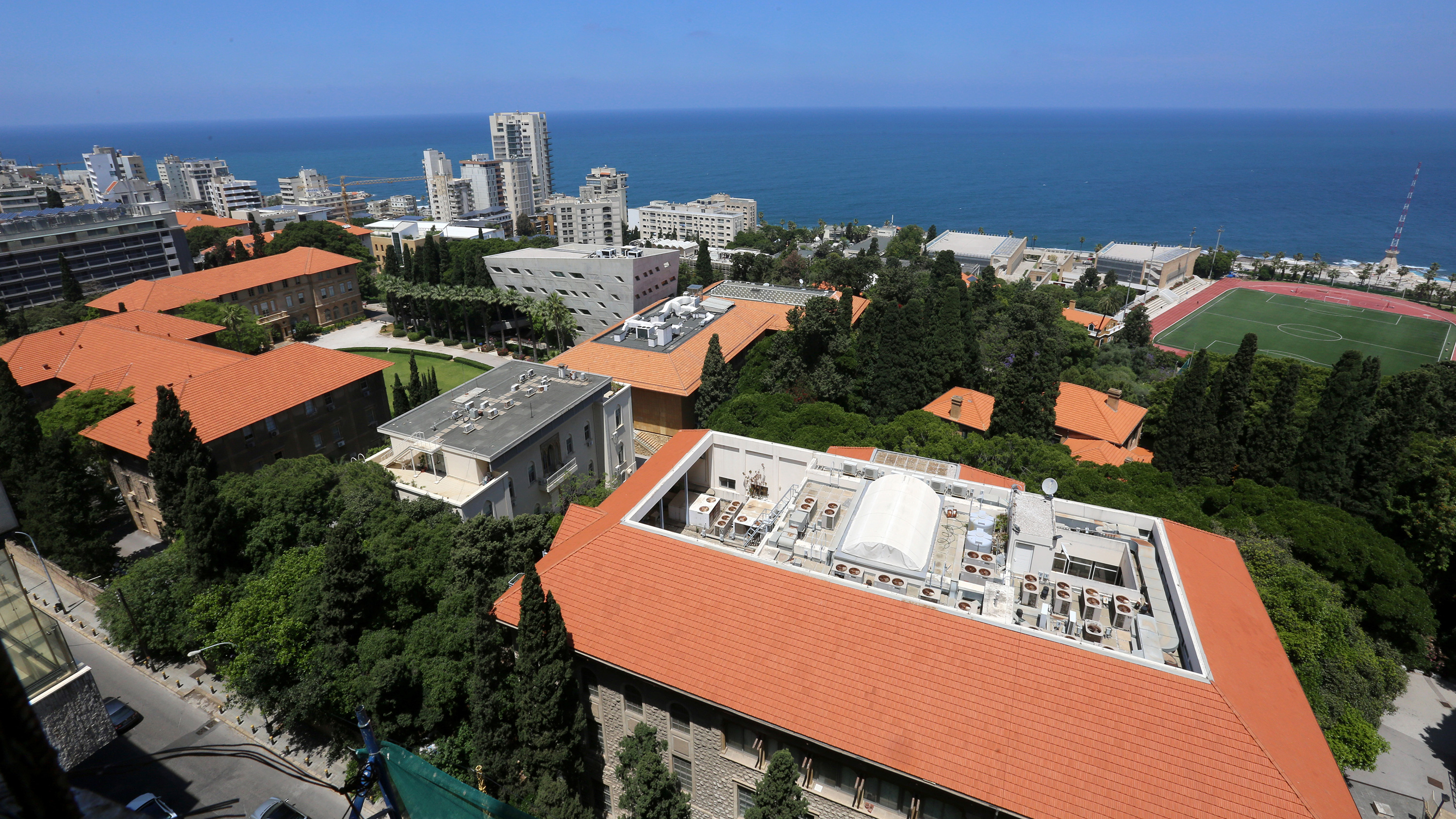 The photo shows an aerial photo of the university.