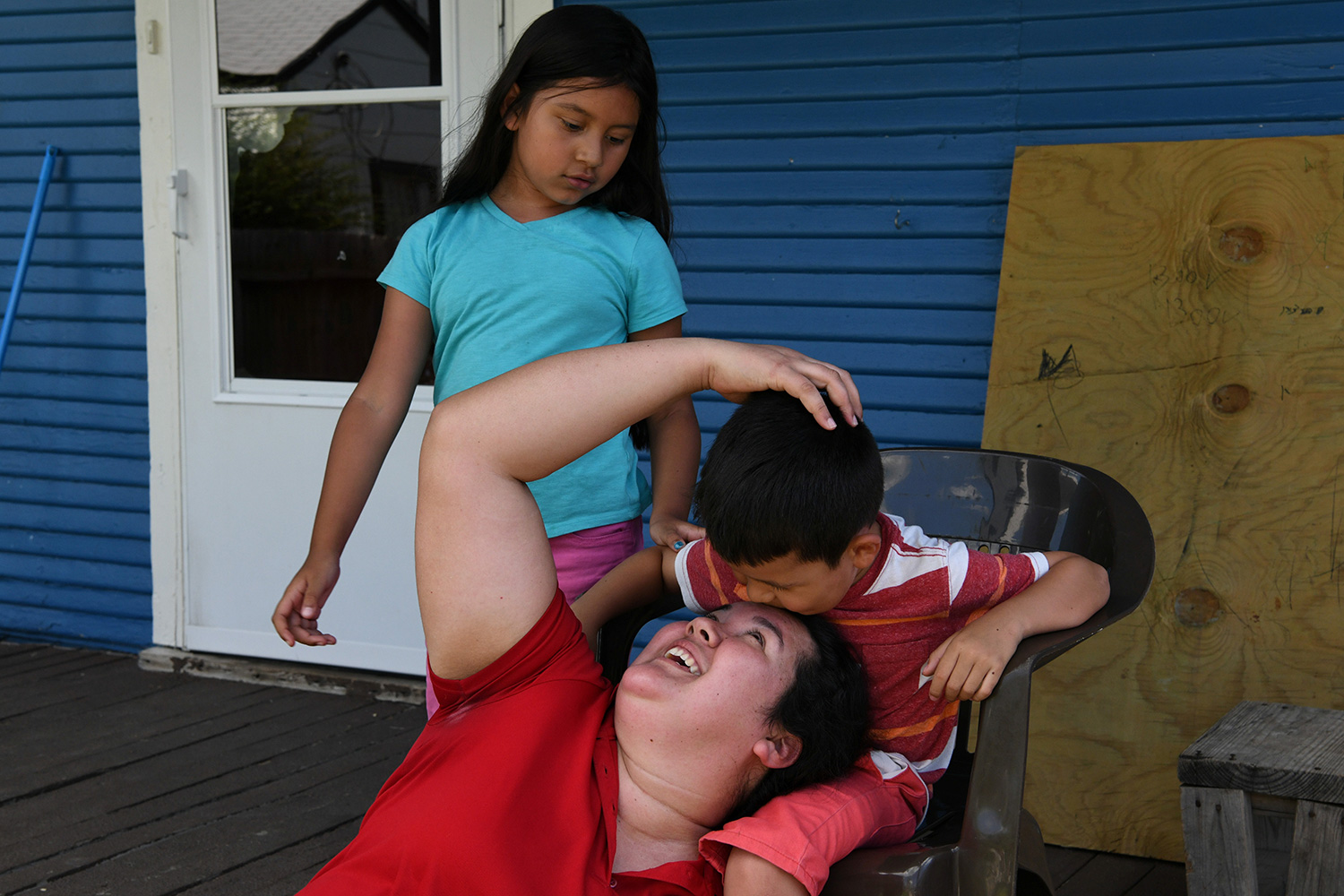 The photo shows Irma laughing with her kids.
