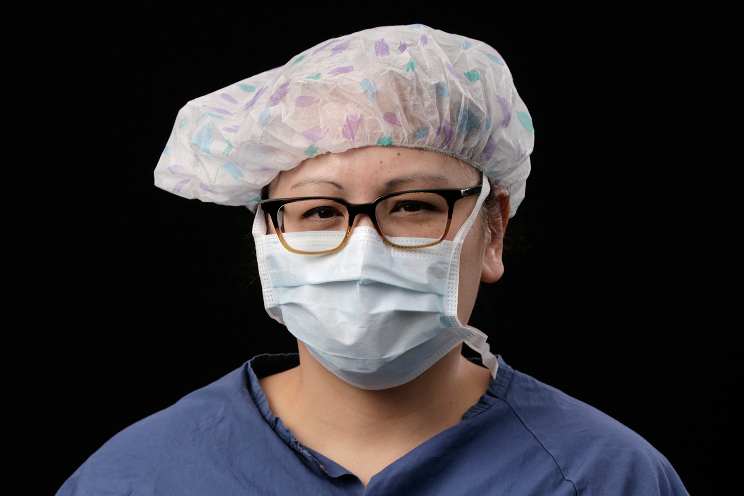 The photo shows Long looking at the camera with protective head gear and a mask.