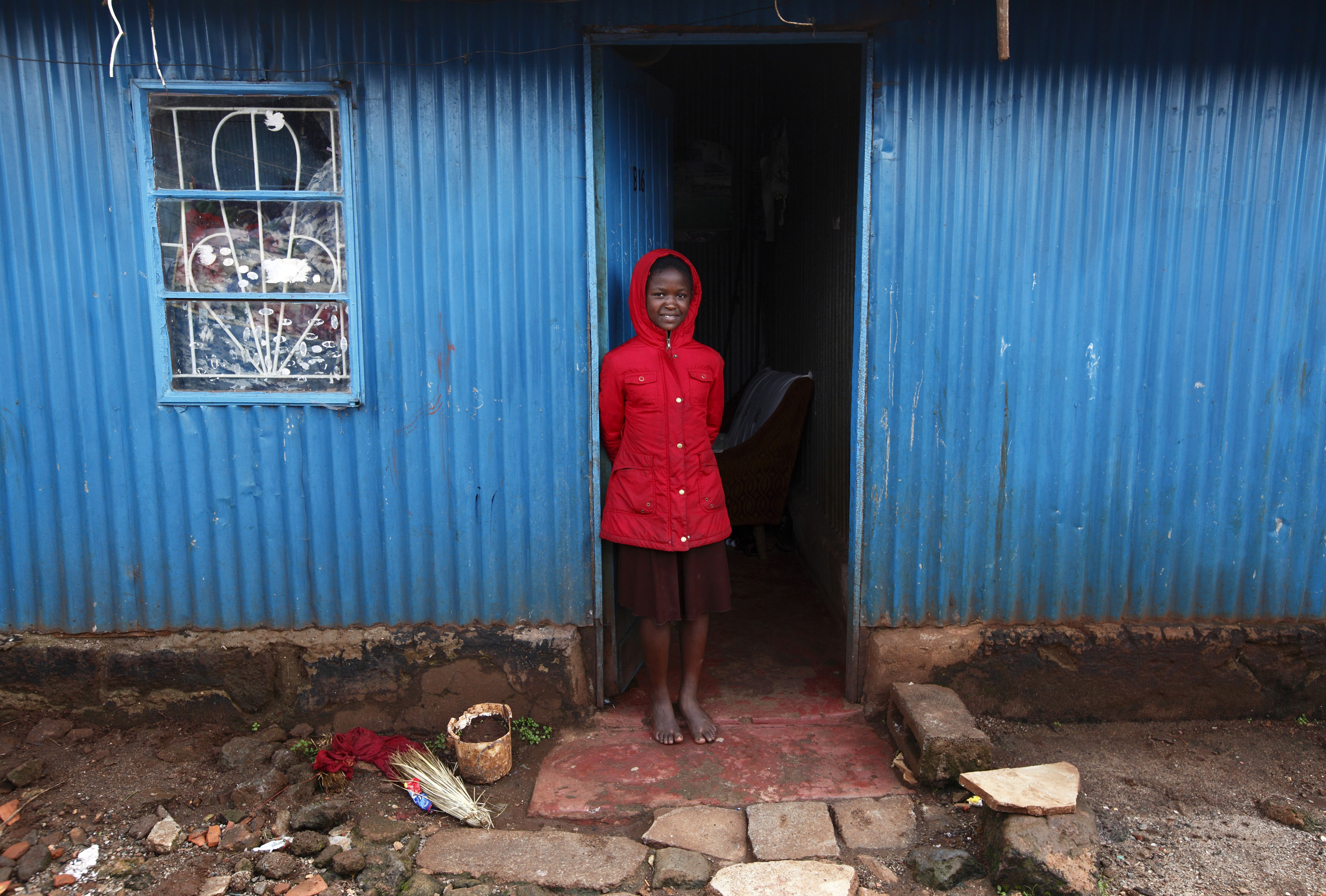 DOCUMENT DATE: April 29, 2013 Fanice Cecilia Nyansiaboka, 12, a participant in the Jesuit-run Upendo programme, stands in the doorway of the home she shares with her father in the Kangemi slum of Nairobi April 23, 2013.