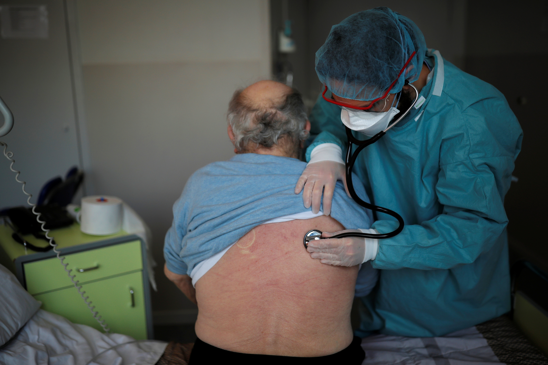A cardiologist examines a patient at the post COVID-19 unit of the Clinique Breteche private hospital in Nantes during the outbreak of the coronavirus disease in France on April 30, 2020.