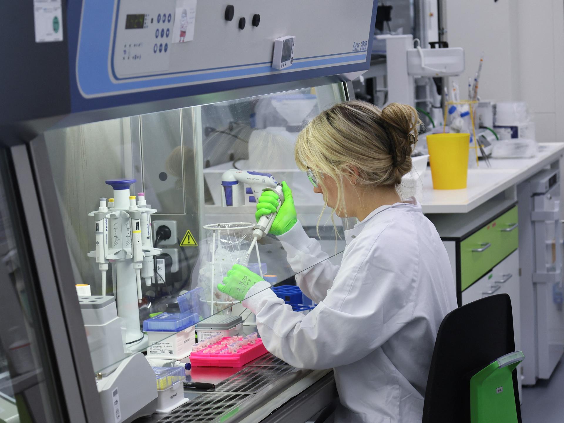 An employee of BioNTtech works at the ''Area 100 R&D'' research laboratory, in Mainz, Germany, on July 27, 2023. 