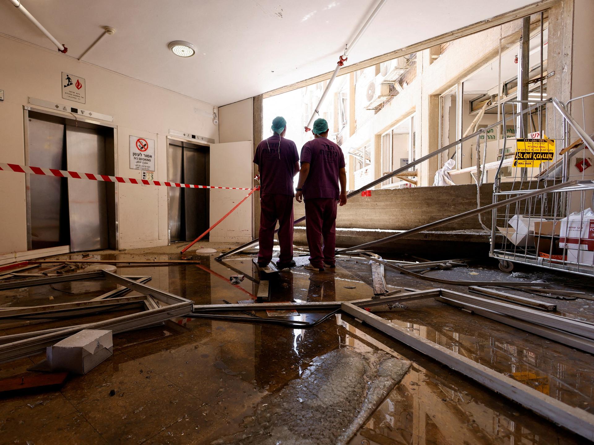 Medical staff inspect the damage at an impact site, following a missile strike from Iran at Soroka Medical Center in Beersheba, Israel, on June 19, 2025.