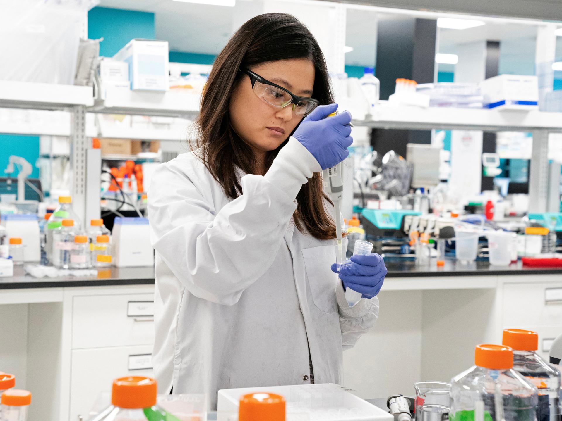 Research assistant Marion Hong, of RNA medicines company Arcturus Therapeutics, conducts research on a vaccine for COVID-19, in San Diego, California, on March 17, 2020. 