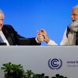 Britain's Prime Minister Boris Johnson and India's Prime Minister Narendra Modi attend a meeting during the UN Climate Change Conference (COP26) in Glasgow, Scotland, Britain, November 2, 2021. 