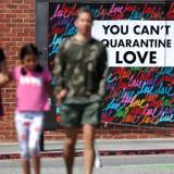 As the COVID-19 pandemic rages on in the United States, street art in Santa Monica, California, sends a message of hope, "you can't quarantine love," on May 11, 2020.