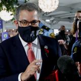 The President of the UN Climate Change Conference (COP26), Alok Sharma, talks to the media as he walks through the conference center in Glasgow.