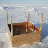 A public toilet stands surrounded by snow near the 2011 Applied Physics Laboratory Ice Station north of Prudhoe Bay, Alaska, March 18, 2011.