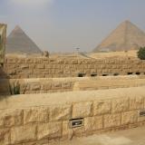 A woman waits in front of a toilet in front of the Sphinx at the Giza Pyramids on the outskirts of Cairo, Egypt, on November 8, 2015.