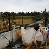 A makeshift shower cabin and toilet are seen atop a deserted hotel, where hundreds of migrants found temporary shelter on the Greek island of Kos, Greece, May 27, 2015.