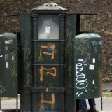 A driver uses the last surviving vespasienne (public urinals) on the boulevard Arago in