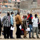 People wait in line to receive the AstraZeneca/Oxford COVID-19 vaccine, donated to Kenya by the UK government, in Nairobi, Kenya, August 8, 2021