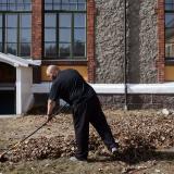 An inmate sentenced to ten months rakes leaves in Bastøy Prison in Horten, Norway on April 11, 2011