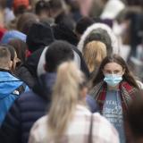 A woman wears a face mask on a busy Queen Street in Cardiff, Wales, United Kingdom on November 21, 2020. 