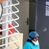 A health worker takes a break at a temporary field hospital set up by Doctors Without Borders during the coronavirus pandemic on July 21, 2020